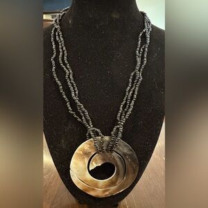 Iridescent White Mother Of Pearl Pendant
With Black Beads